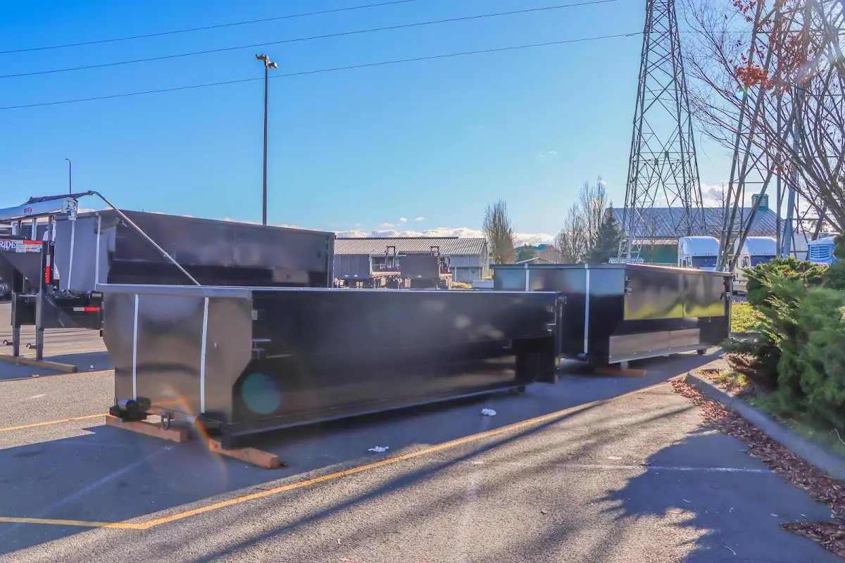 Roll-off dumpster ready for waste disposal at job site for 2 Yard Dumpster Rental in Country Club Hills